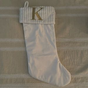 White Christmas stocking with gold K initial